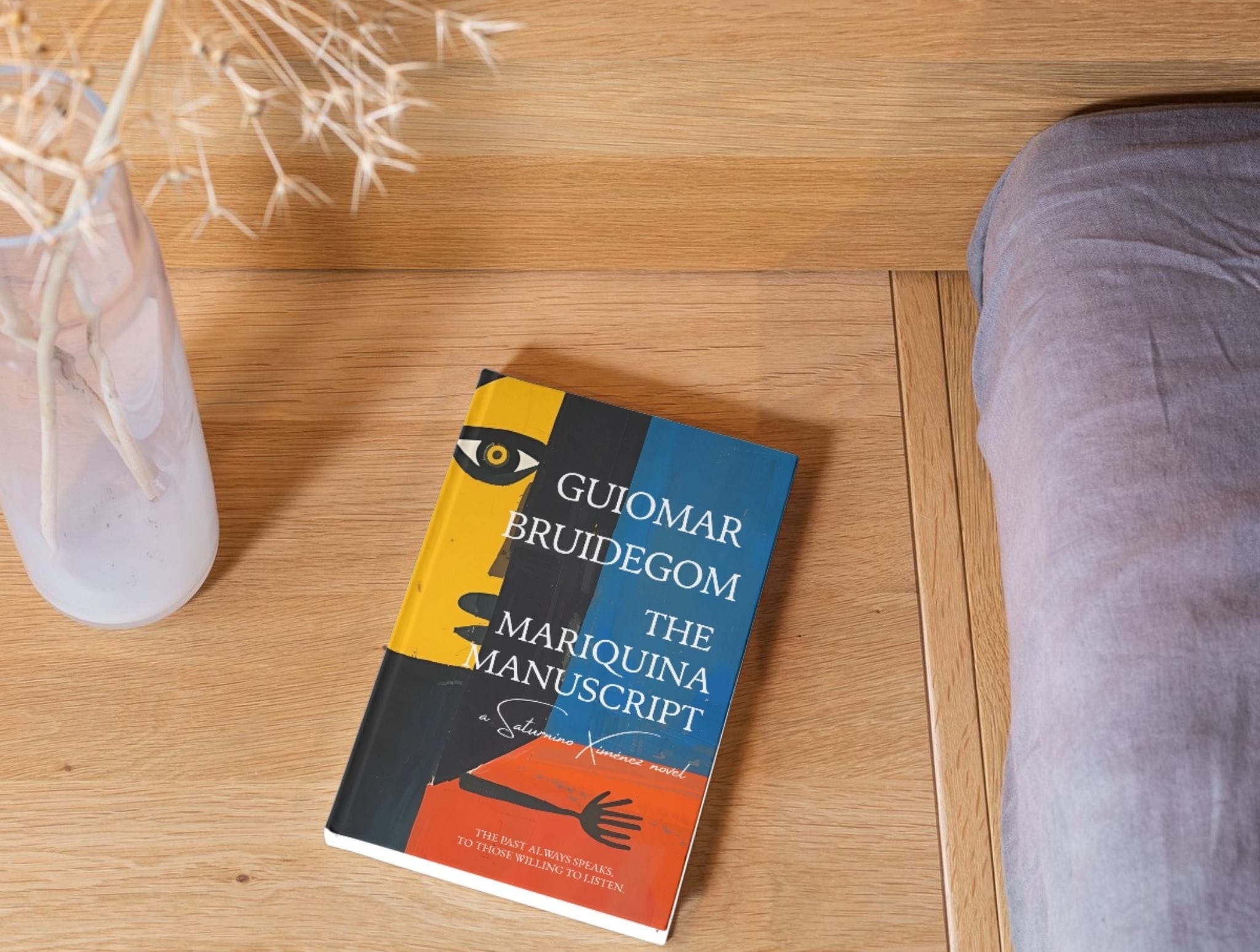 The Mariquina Manuscript paperback on bedside table